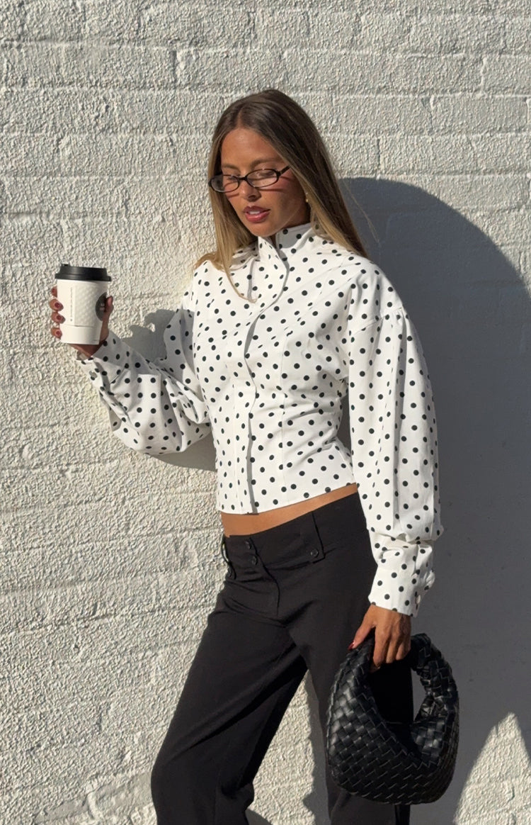 Beginning Boutique Front Page White Polka Dot Jacket white polka dot cropped jacket with high neck tie, puff sleeves, and button front