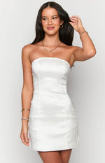 Front view of a white strapless mini dress with a subtle sheen, vertical seams, and a side zipper
