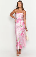 Side view of the pink floral print maxi skirt showing the flowy fabric and a subtle side slit