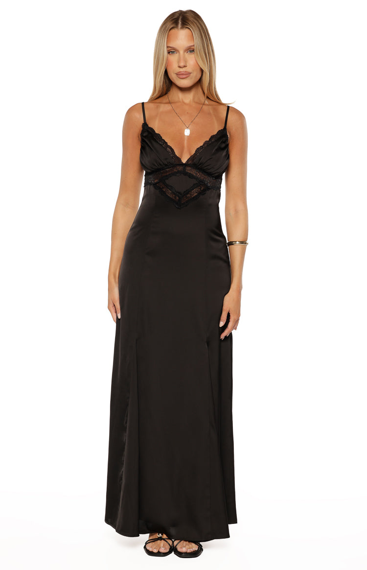 Black satin maxi dress with a V-neckline, delicate lace trim, ruched bust, and thin spaghetti straps