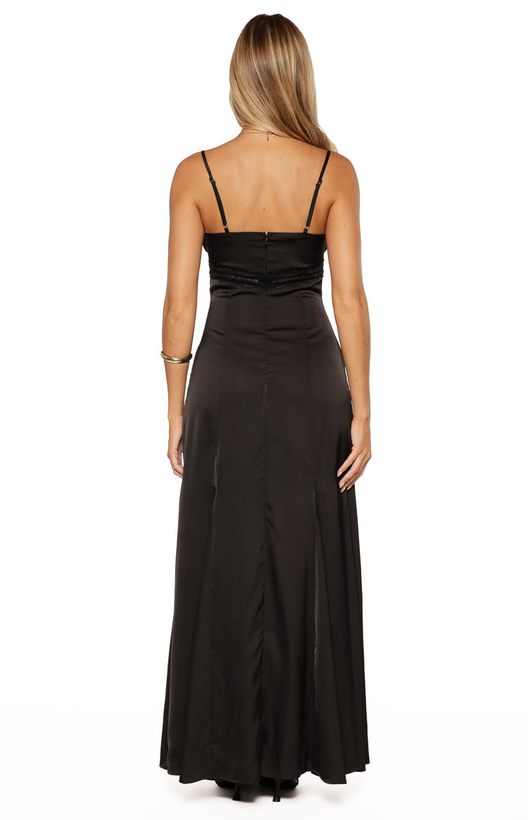 Rear view of a black satin maxi dress with adjustable spaghetti straps, lace trim at the back waist, and a back zipper