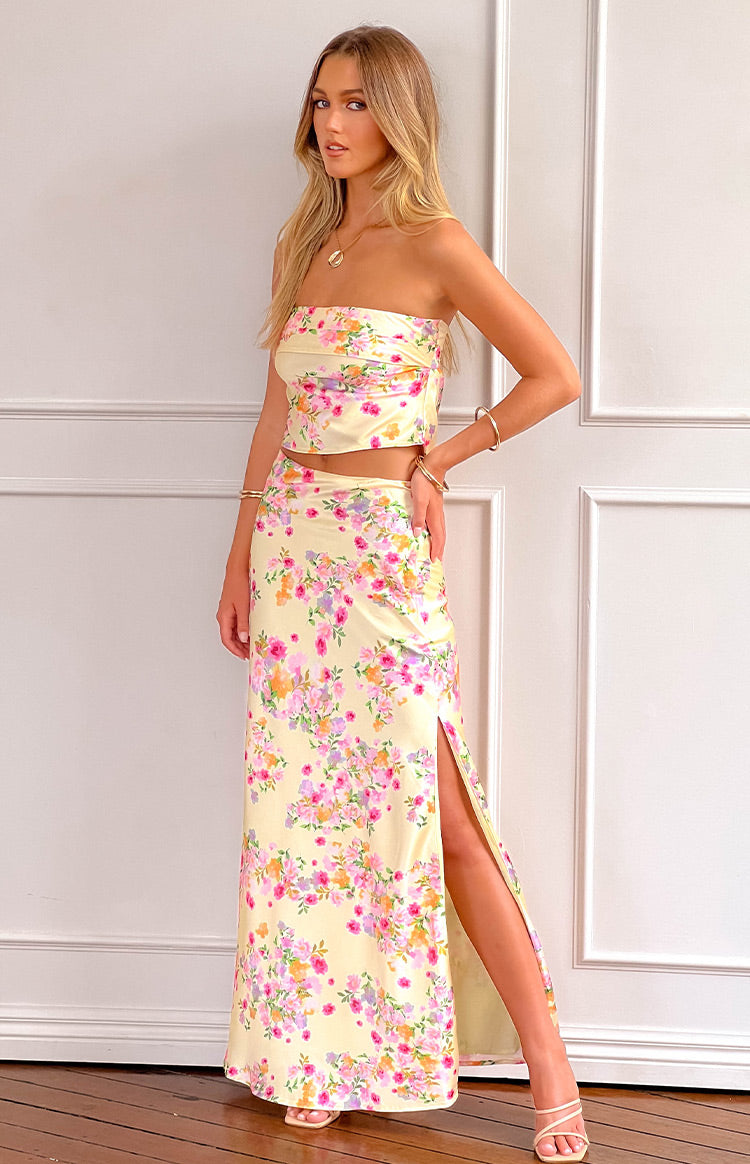 Beginning Boutique Genevieve Yellow Bloom Maxi Skirt yellow floral print satin high-waisted maxi skirt with a high side split