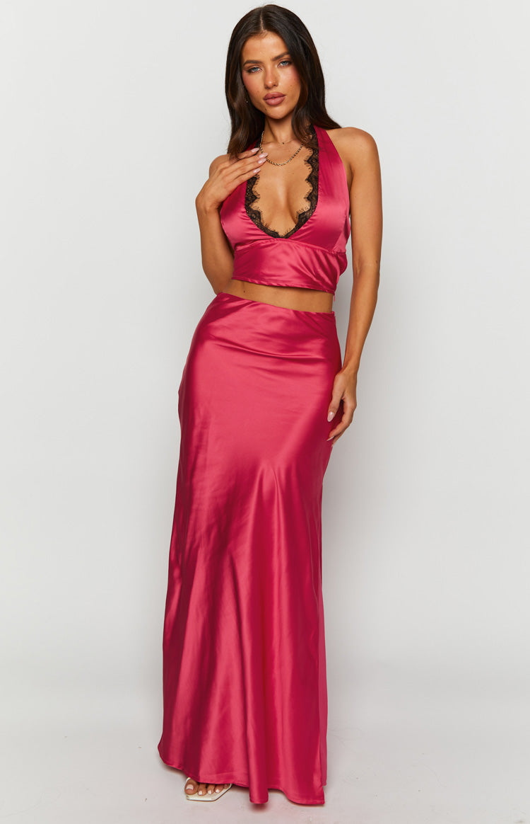 Front view of a bright pink satin maxi skirt with a smooth, high-waisted fit and a long, fluid drape