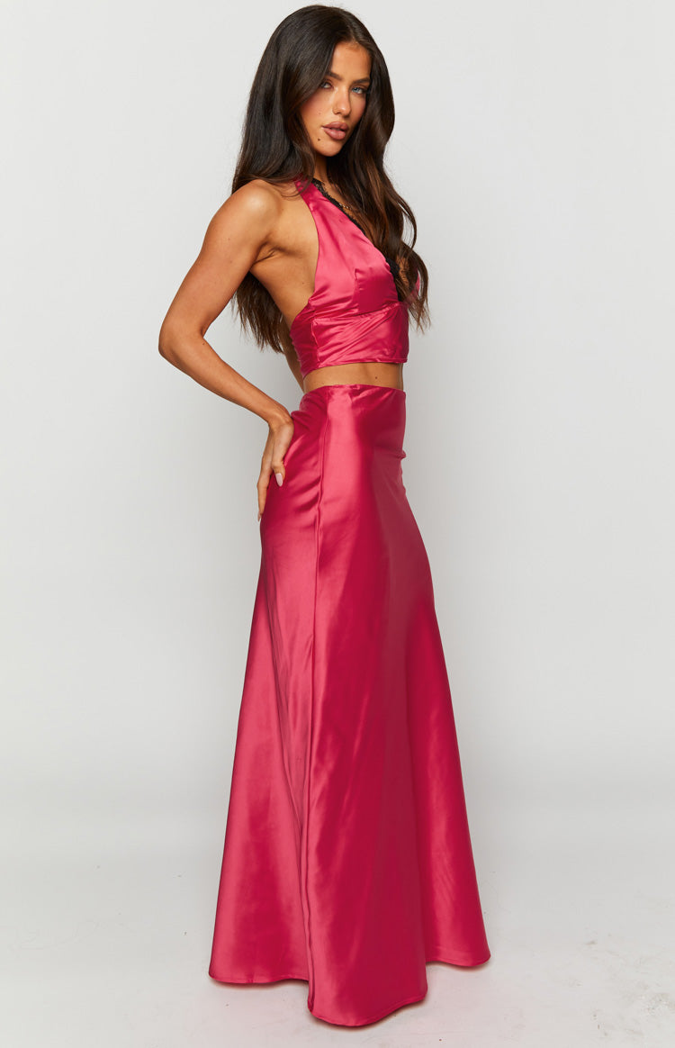 Side view of a high-waisted pink satin maxi skirt with a flowing A-line silhouette