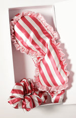 Pink and white striped satin eye mask with ruffled edges and matching scrunchie