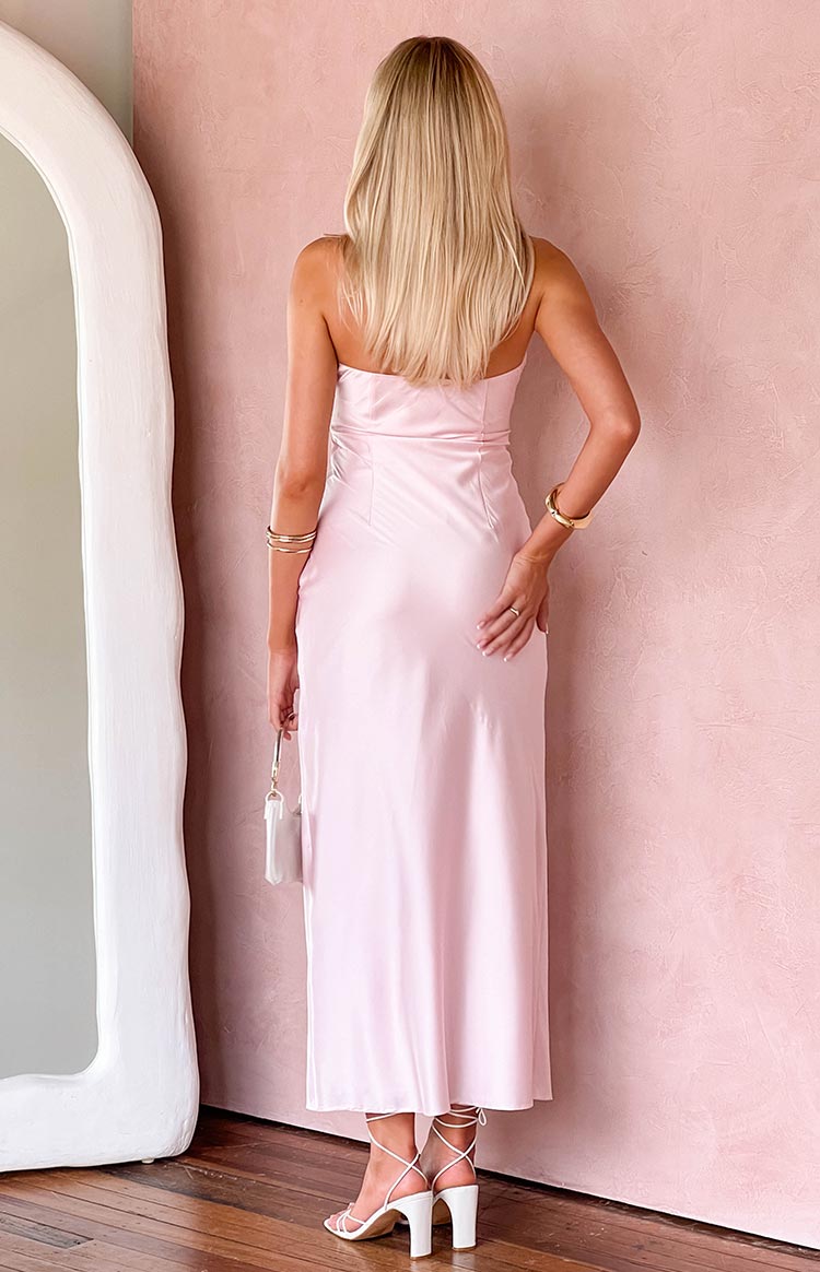 Rear view of a light pink strapless satin maxi dress with a fitted bodice and flowing skirt