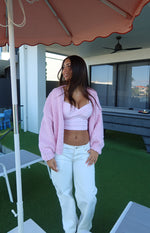 White denim low rise jeans with a relaxed straight leg and subtle contrast stitching