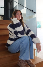 Relaxed fit navy and cream striped chunky knit sweater with wide sleeves and ribbed cuffs
