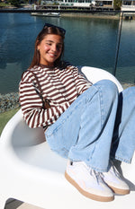 Relaxed fit chocolate and white stripe long sleeve top with a crew neck and dropped shoulders