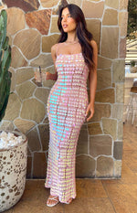 Full length front view of a pink sequin maxi dress with thin spaghetti straps and a fitted silhouette
