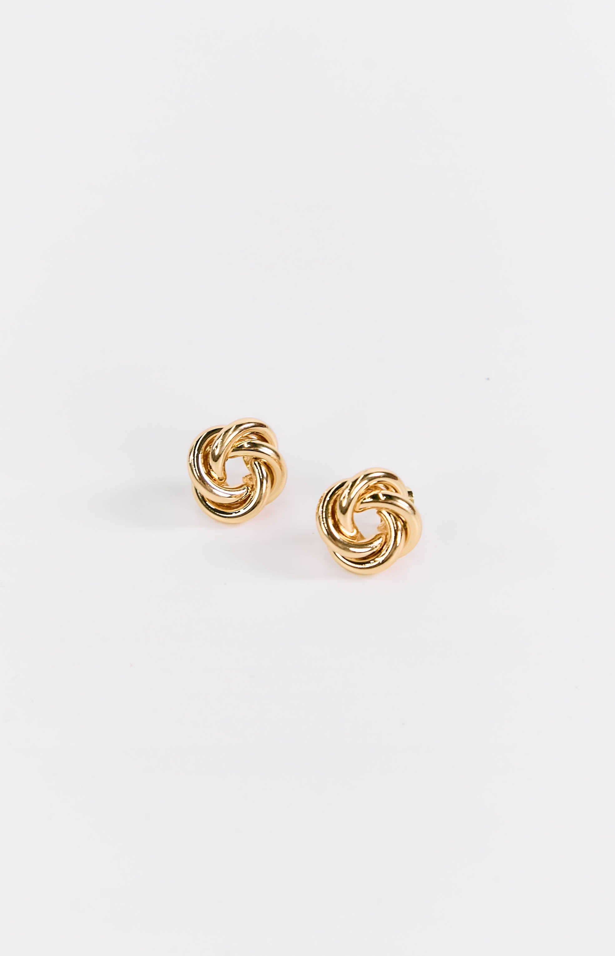 Pair of gold stud earrings with a polished finish and intricate twisted knot design
