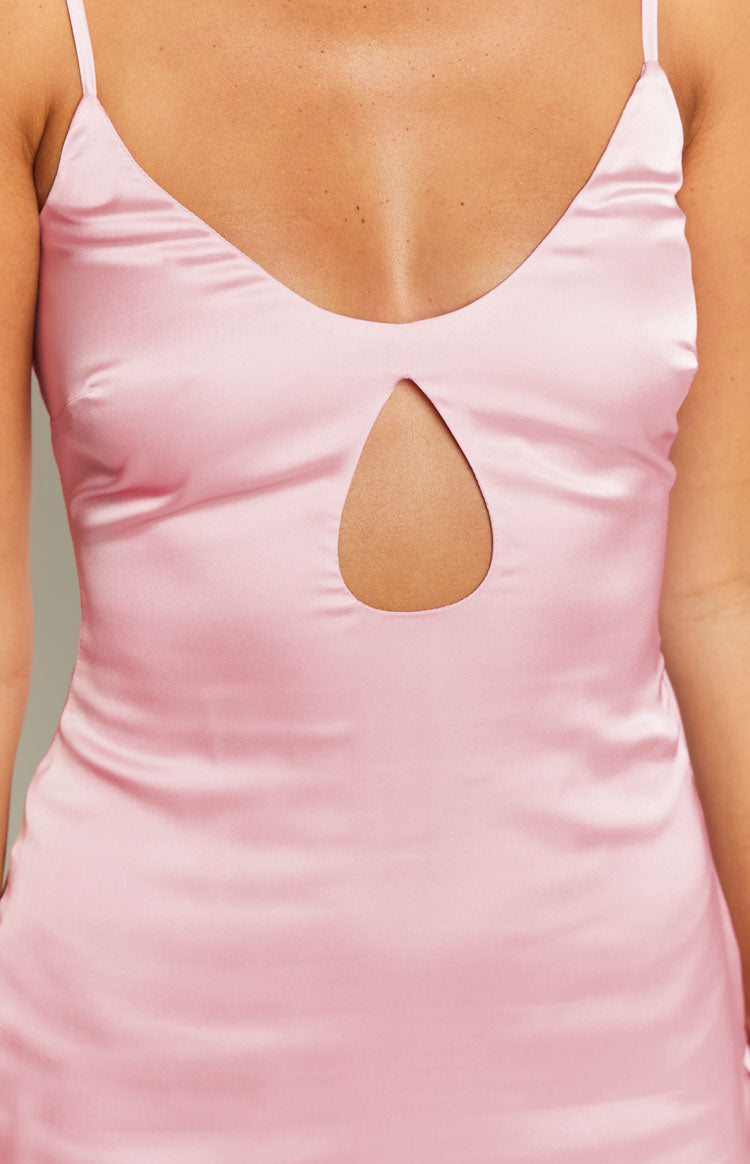 Close-up of the teardrop cutout detail on the front of a pink satin mini dress