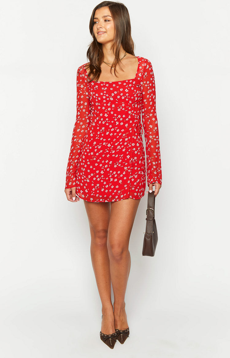 Red floral mini dress with a square neckline, sheer long sleeves, and tie-side skirt