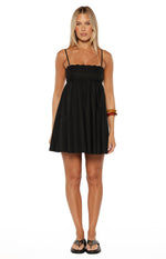 Front view of the black mini dress showing the scalloped neckline and eyelet embroidery on the bodice