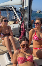 Top band of pink and red polka dot bikini bottoms with red contrast binding swim