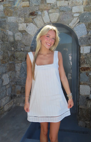 Beginning Boutique Jenny White Lace Trim Mini Dress white square neck mini dress with scalloped lace trim and subtle vertical