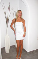 Fitted white strapless mini dress with a structured bodice and vertical seam detailing
