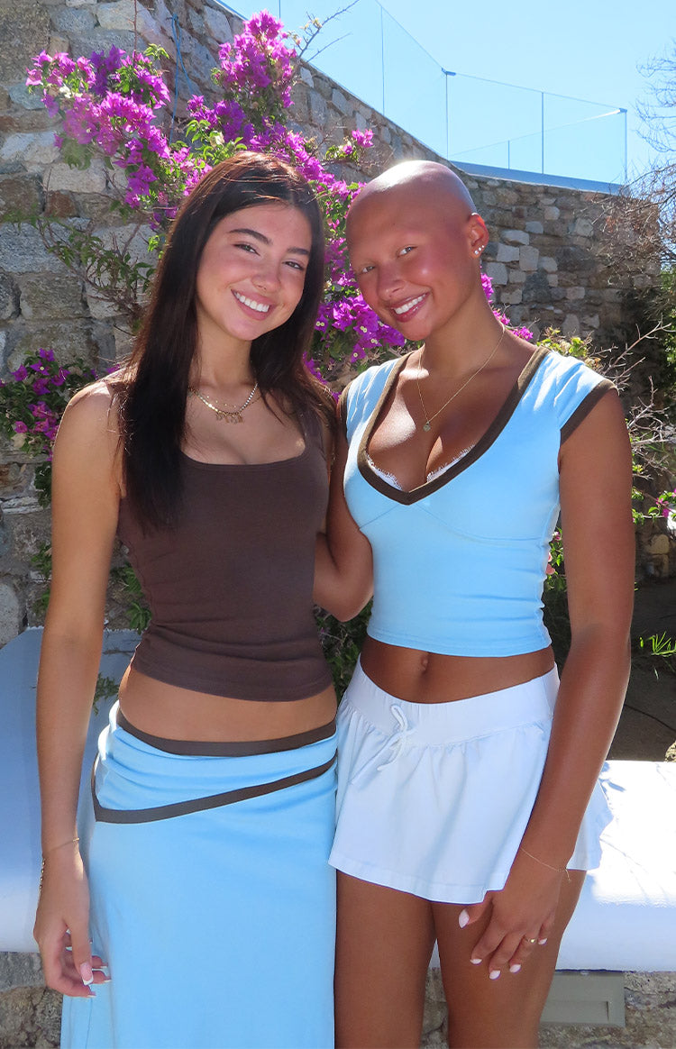 Brown scoop neck tank top with a fitted silhouette and slightly cropped hem