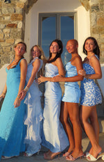 Front view of a bright blue lace formal maxi dress with a deep V-neck and thin spaghetti straps