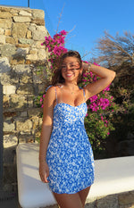 Blue floral print mini dress with a sweetheart neckline and tie-shoulder spaghetti straps