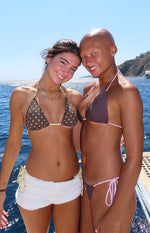 Front view of brown bikini bottoms with pink adjustable tie sides and classic brief cut
