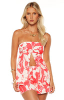 A close up view of the Gypsy Red Floral Strapless Top showing the open bodice detail making it a perfect top for a date night or party.