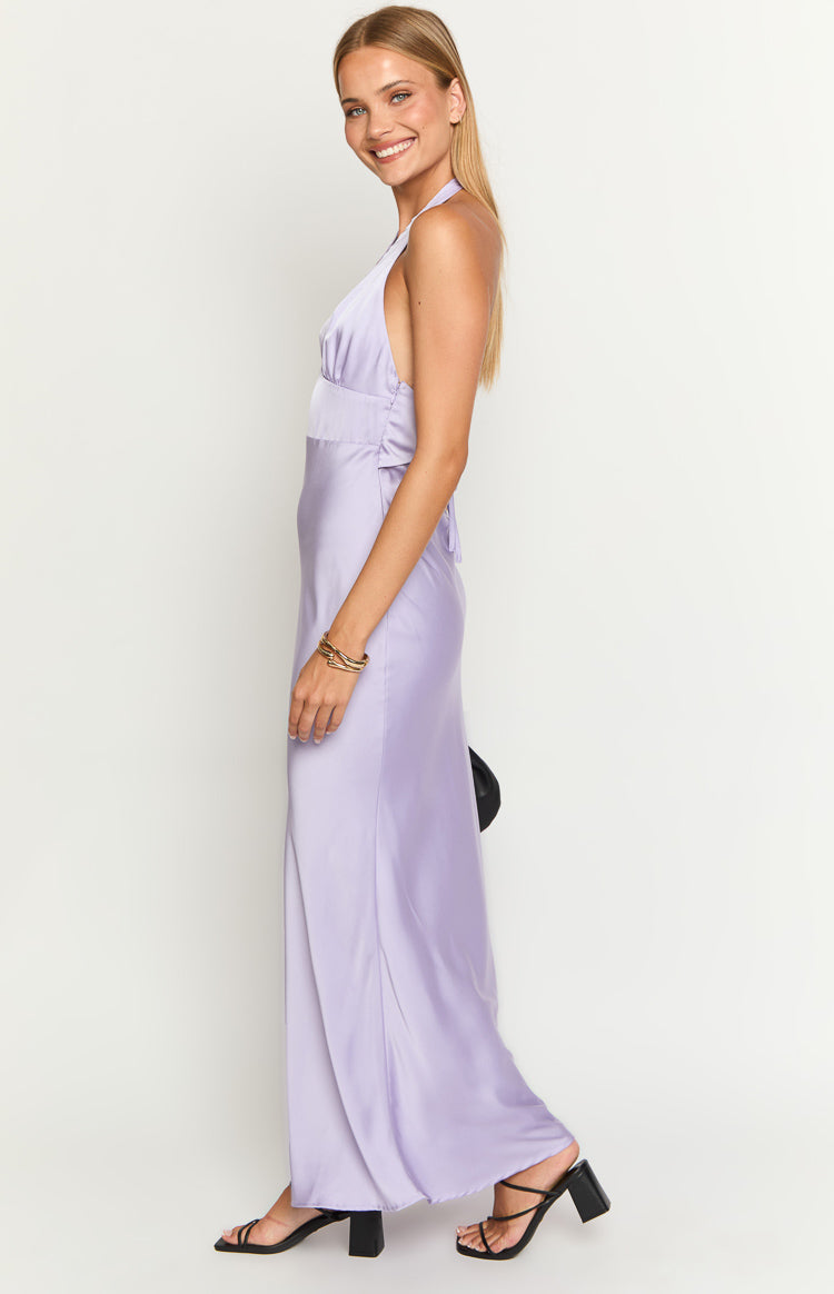 Side view of a purple satin maxi dress with a halter neckline and ruched bust