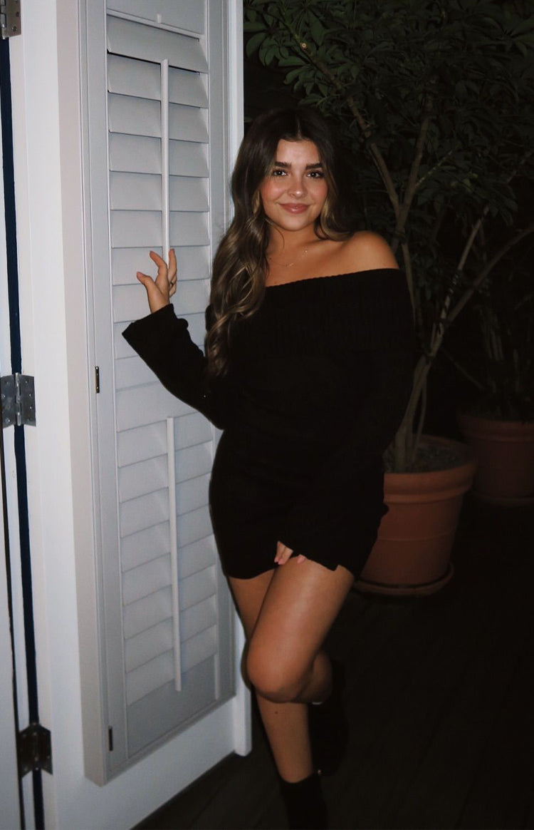 Beginning Boutique Halia Black Long Sleeve Mini Dress black ribbed knit off-shoulder long sleeve mini dress with wrap skirt detail