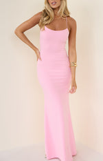 Front view of a pink crepe maxi dress with a scoop neckline and thin spaghetti straps, showing the fitted silhouette