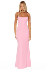 Front view of a pink crepe maxi dress with a straight neckline, thin spaghetti straps, and a fitted silhouette that gently flares at the hem