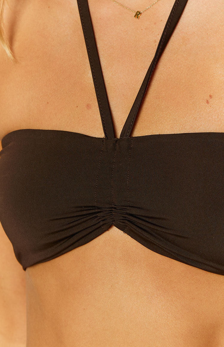 Close-up of the chocolate halter crop top showing the central ruched bust detail and thin halter straps