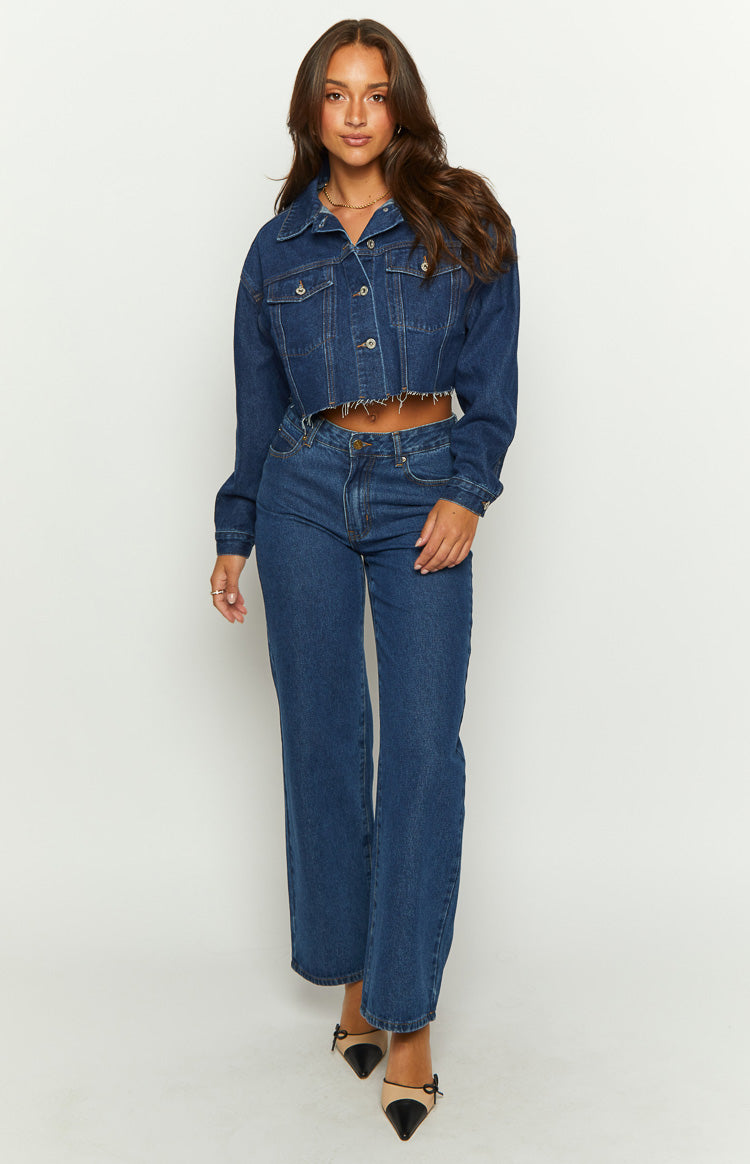 Dark wash denim cropped jacket with frayed hem and long sleeves