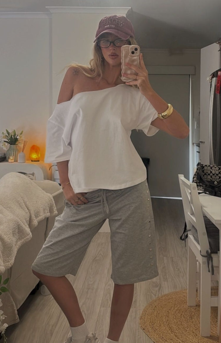 Beginning Boutique Henrie White Off Shoulder Boxy Tee white off-shoulder wide neck boxy tee with elbow-length sleeves