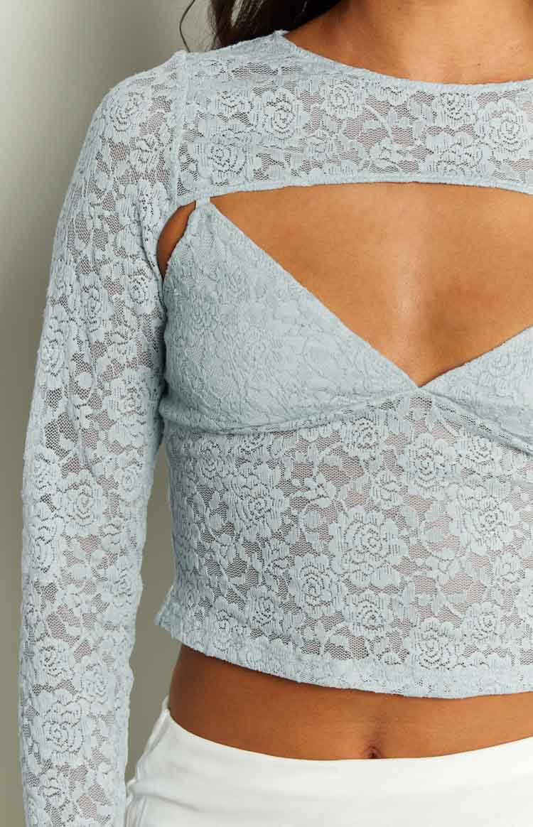 Close-up of the blue floral lace shrug with chest cutout over a matching cami