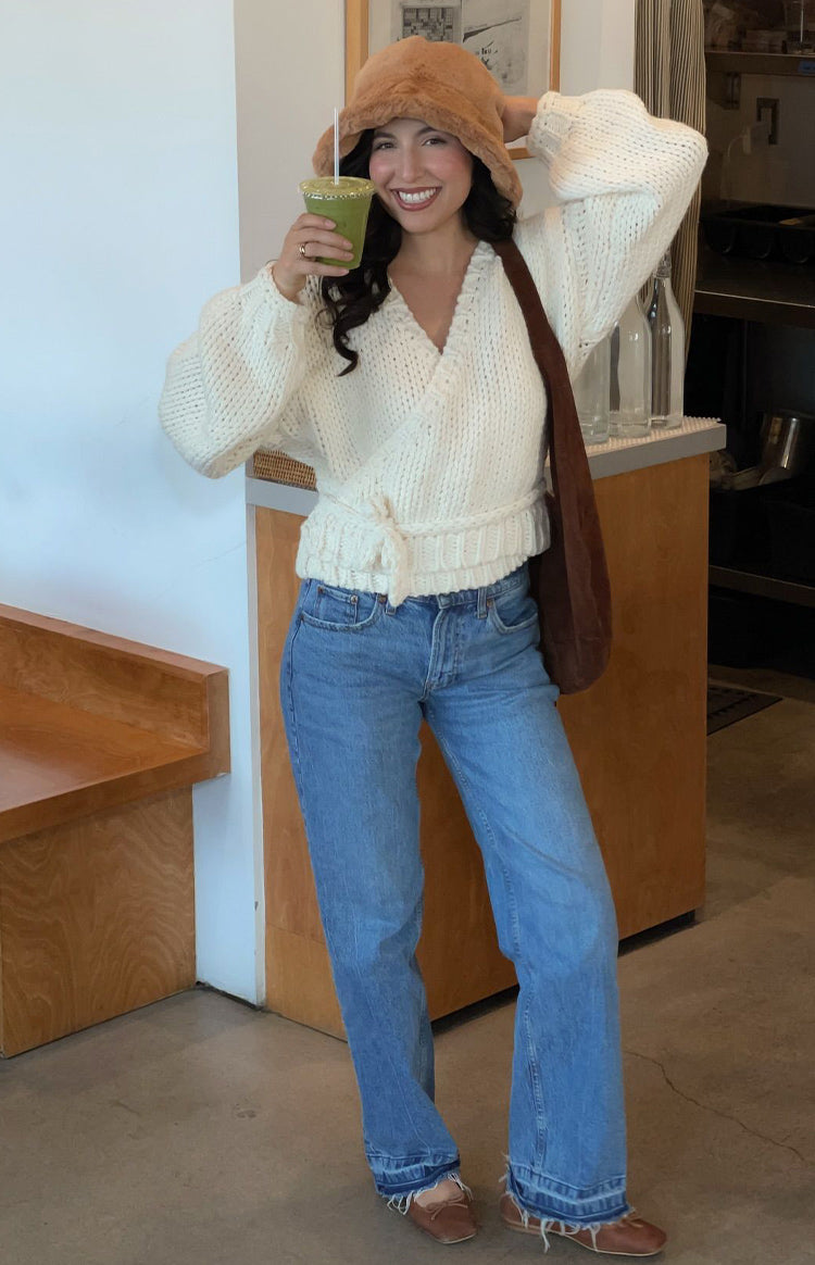 Cream chunky knit wrap cardigan with a tie-waist detail and voluminous long sleeves