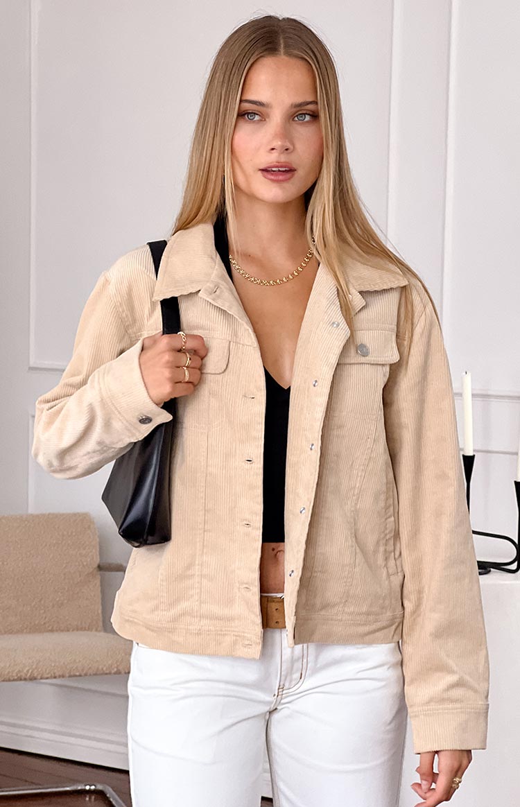 Cream corduroy western jacket with a classic collar, button-front, and flap chest pockets