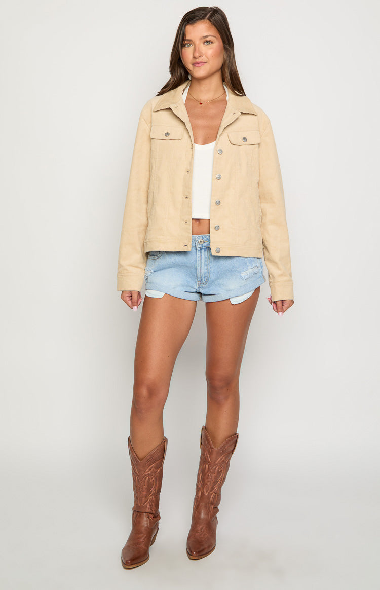 Front view of a cream corduroy western jacket with a relaxed fit, button-front, and chest pockets