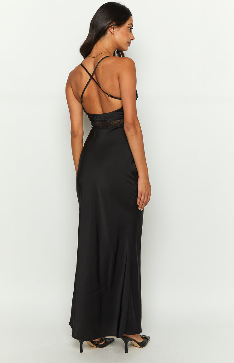 Rear view of a black satin maxi dress featuring criss-cross spaghetti straps, a low back, and lace detail at the waist