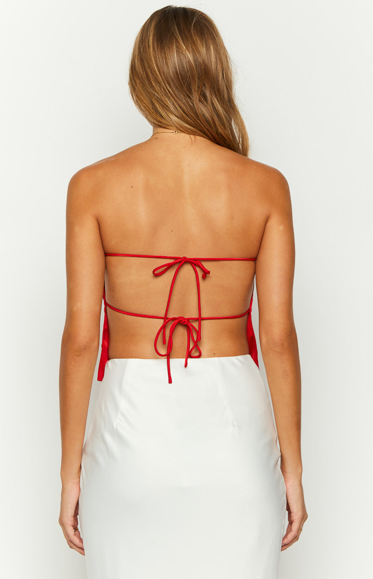 Rear view of a red satin strapless top with an open back and multiple thin tie straps