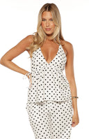 Beginning Boutique Imee White Polka Dot Top white polka dot halter top with deep V-neck and gathered waist with side ties