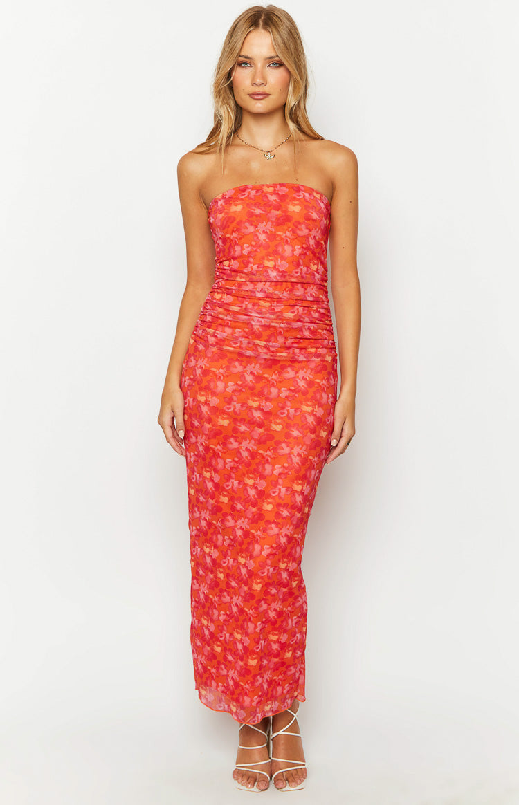 Front view of an orange floral print strapless maxi dress with extensive ruching on the bodice and body