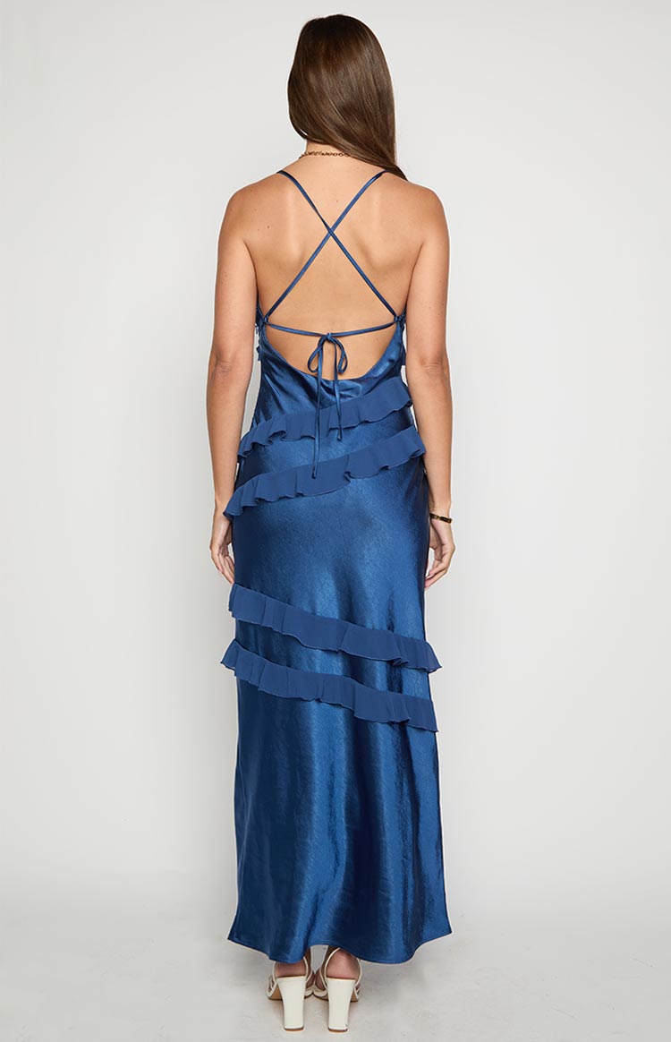 Rear view of a navy maxi dress with a low scoop back, criss-cross tie straps, and tiered ruffles