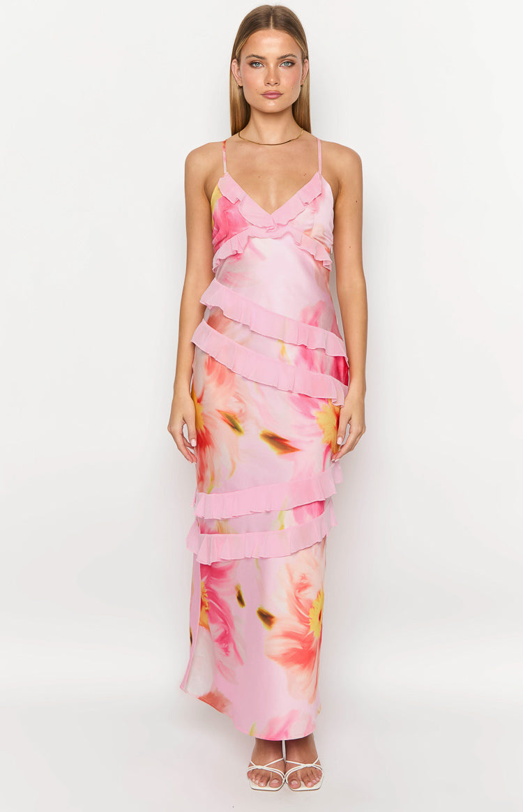 Front view of a light pink floral maxi dress with a V-neck, thin straps, and tiered ruffles