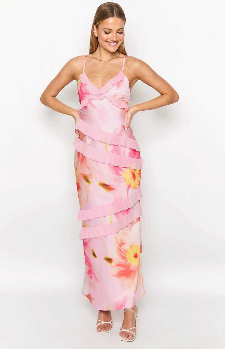 Light pink floral print maxi dress with a ruffled V-neck and tiered ruffles cascading down the skirt