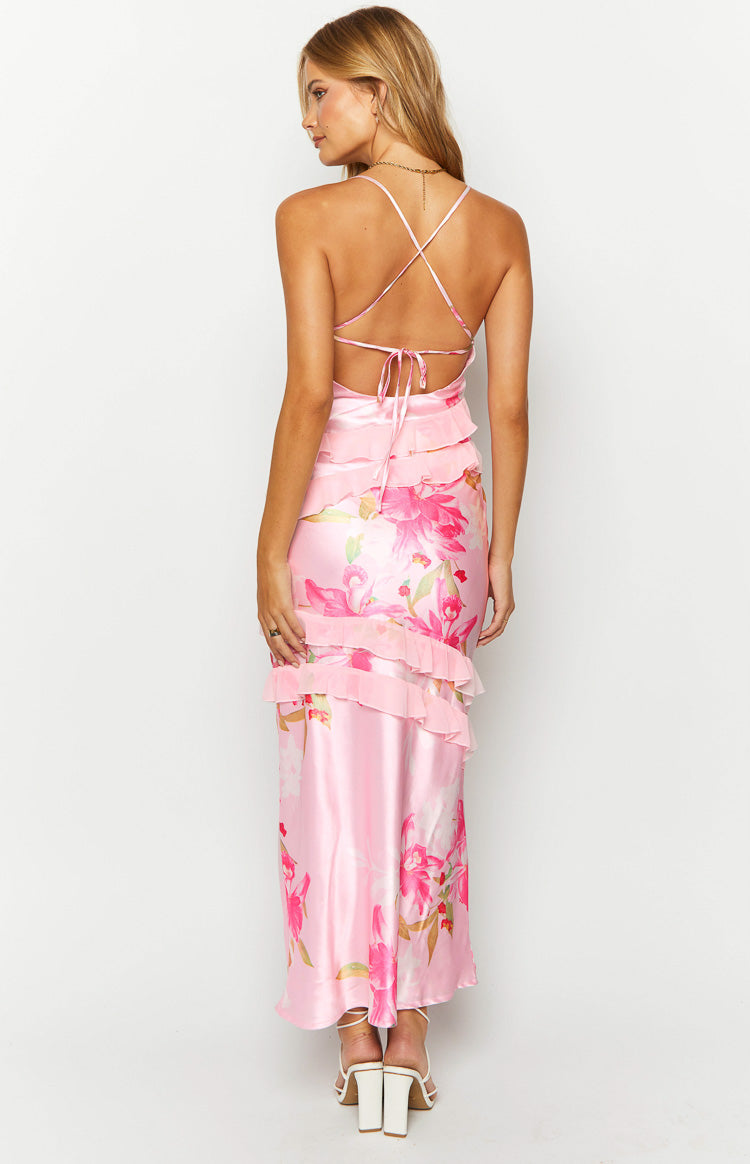 Rear view of a pink floral print maxi dress with criss-cross tie-back spaghetti straps and tiered ruffles