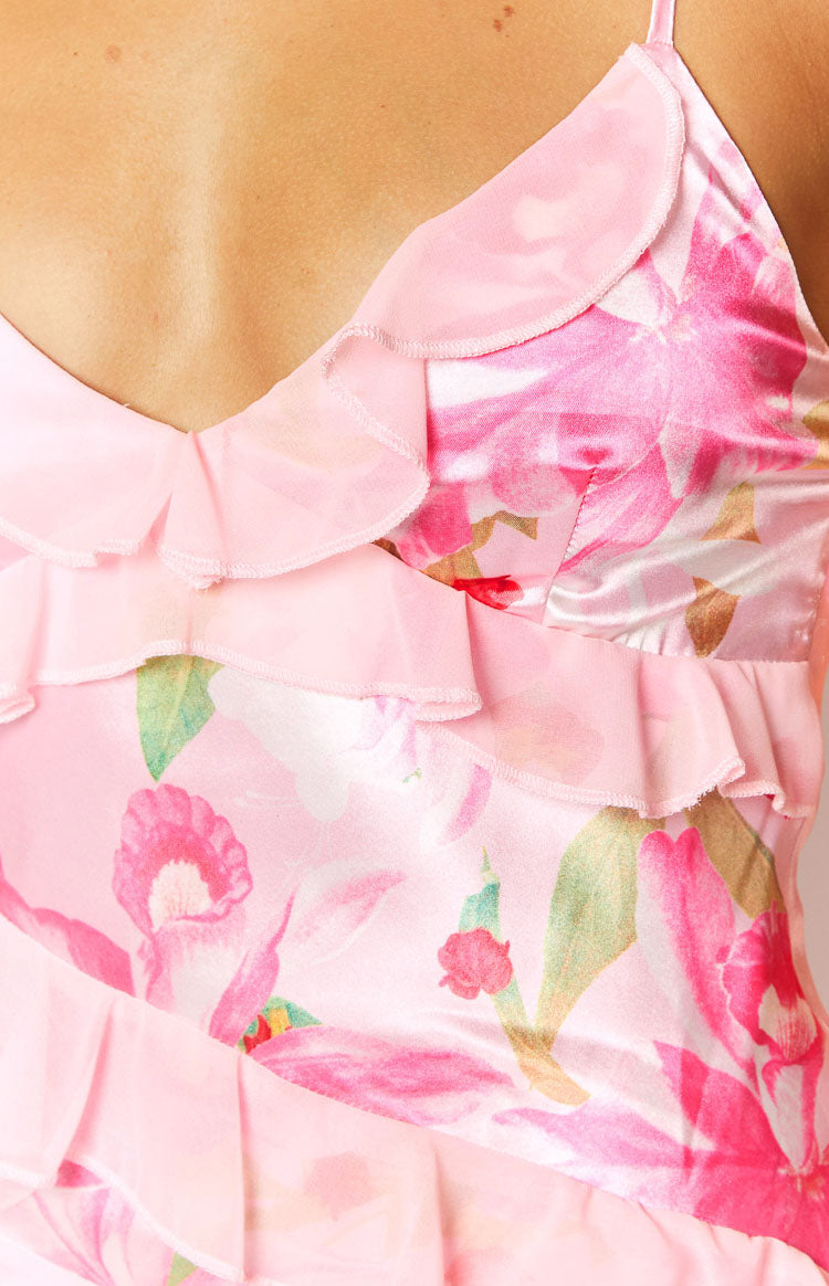 Close-up of the pink floral print satin maxi dress showing tiered chiffon ruffles on the V-neckline