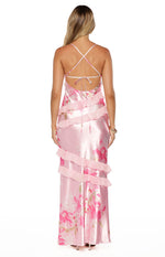 Rear view of a pink floral maxi dress with criss-cross tie-back straps and tiered ruffles