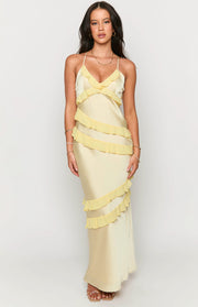 Pale yellow satin maxi dress with a V-neck, spaghetti straps, and cascading sheer yellow ruffles
