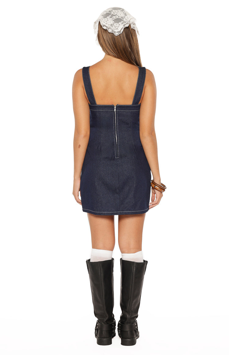 Rear view of a dark wash denim mini dress with a full-length silver zipper and white contrast stitching
