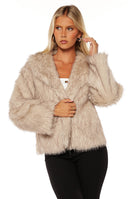 Beginning Boutique It Girl Sand Faux Fur Jacket sand faux fur jacket with a wide collar and long sleeves